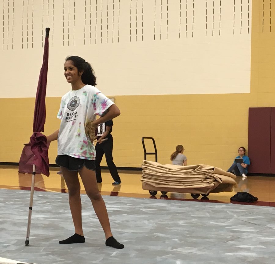 Sophomore+Bow+Kancharla+is+practicing+for+color+guard+but+in+her+free+time+she+juggles+having+good+grades+to+be+able+to+stay+in+guard.