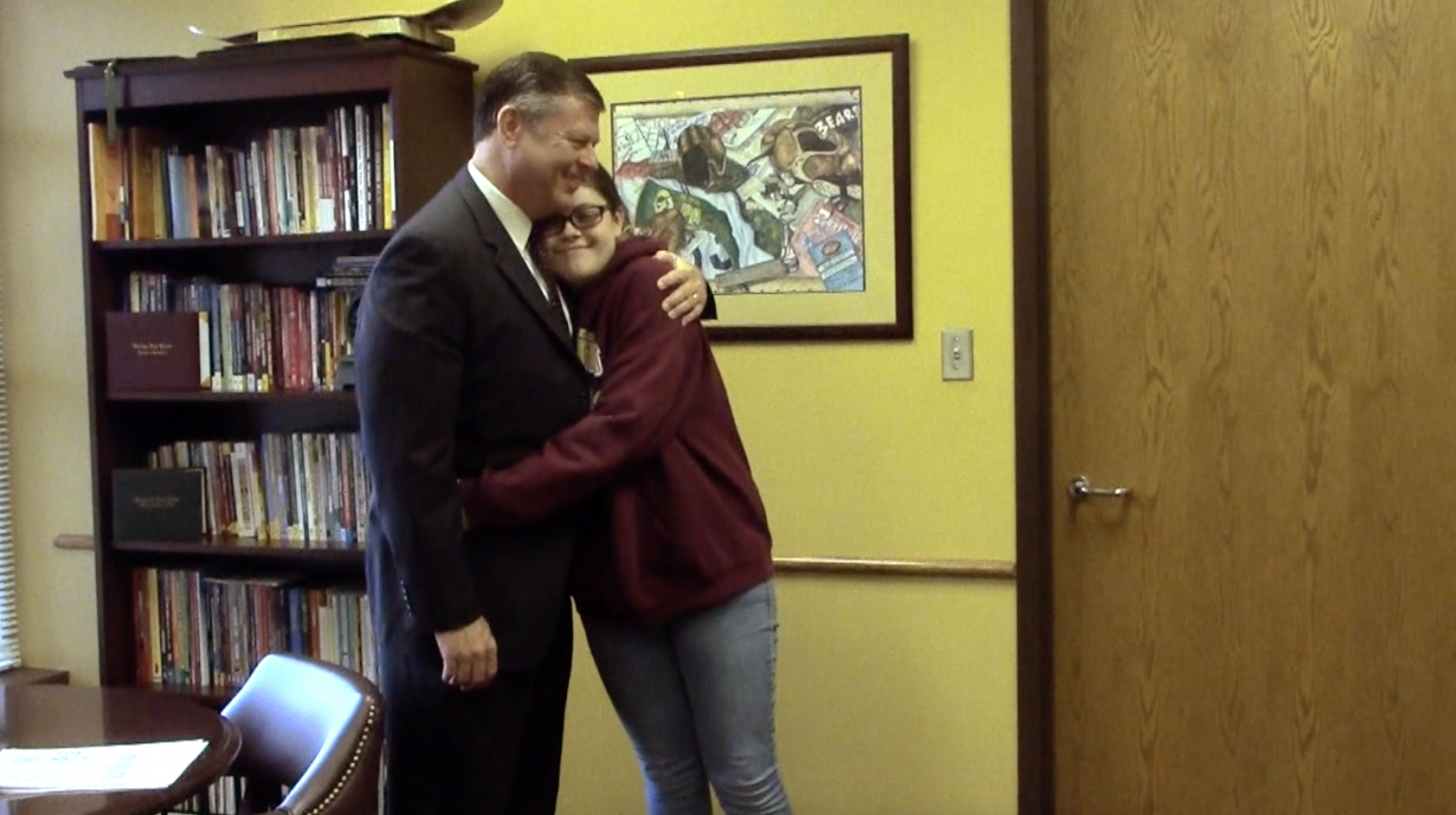 Mr. Mimms and Jillian share a special father-daughter moment together while visiting before school.