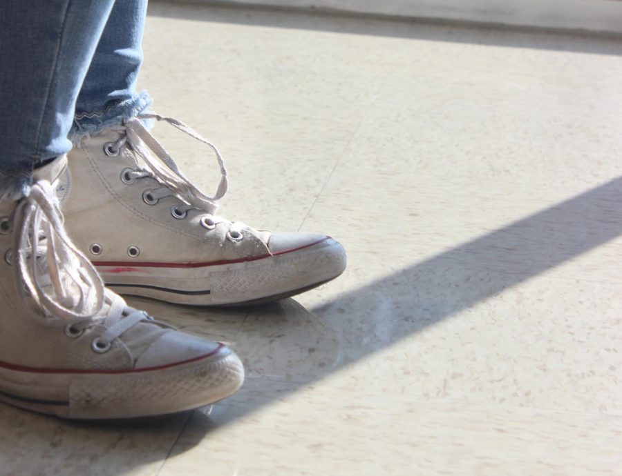 A pair of shoes worn by a student. 