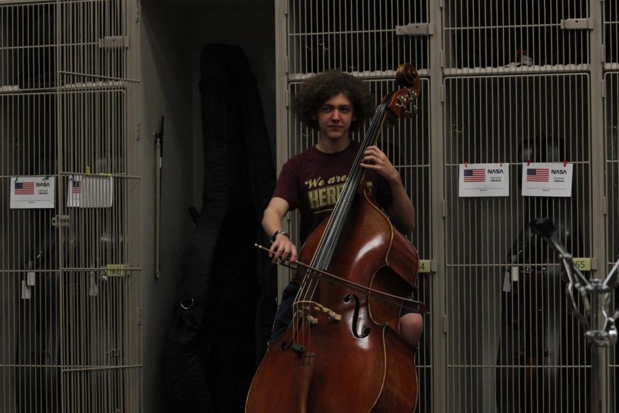 Sophomore Finnegan Powers practices bass in preparation for all-region competition.