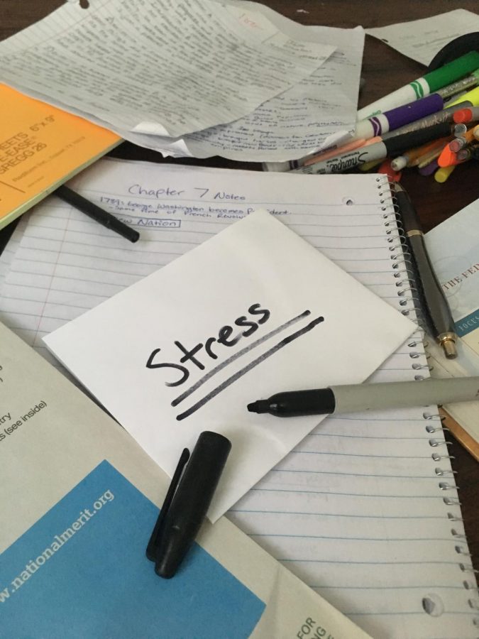 A messy desk filled with papers is a common piece of furniture in the room of a teenager in 2018.