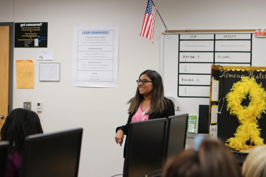 Ximena Pastor presents to students at Maus Middle School about cancer and related careers.