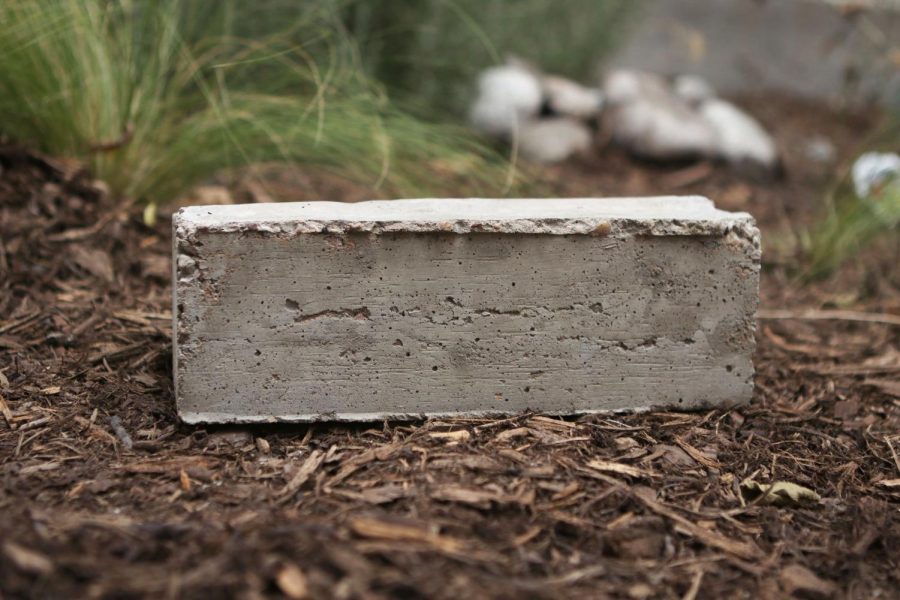 Set your completed ecobrick in a measured amount of
wet concrete. You can purchase concrete from any homeimprovement store, such as Home Depot or Lowe’s. The ecobrick will reach its full strength in around 28 days, however will likely be ready for use before then.
