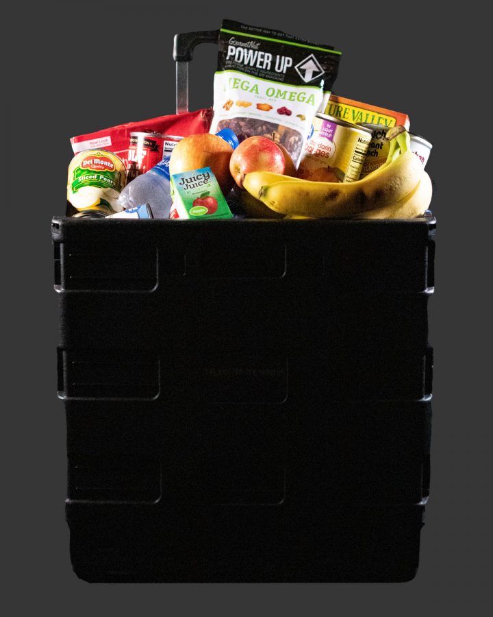 Students in the cafeteria place their leftovers in a black bin every day. They are able to put unopened and uneaten foods and to be donated to the local community.