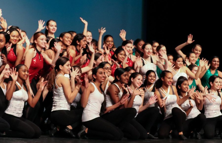 As the curtains come to a close, dance 1 waves their hands to show their holiday spirit.