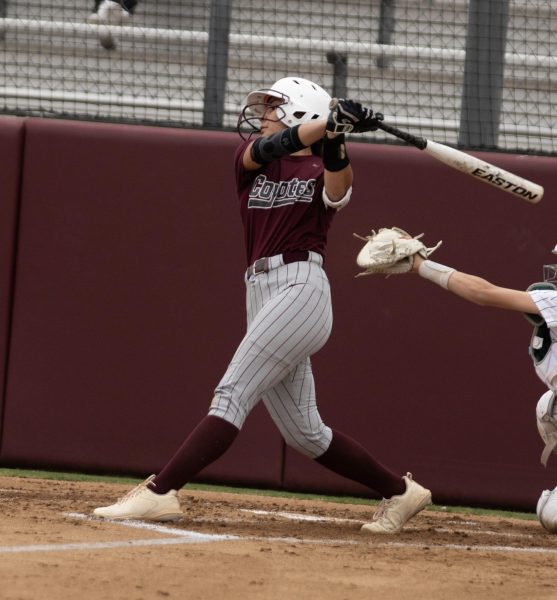 Senior Vyanna Quezada takes a big swing, showcasing her strength after missing time with an injury last year. (Photo by Harmon Diemont)
